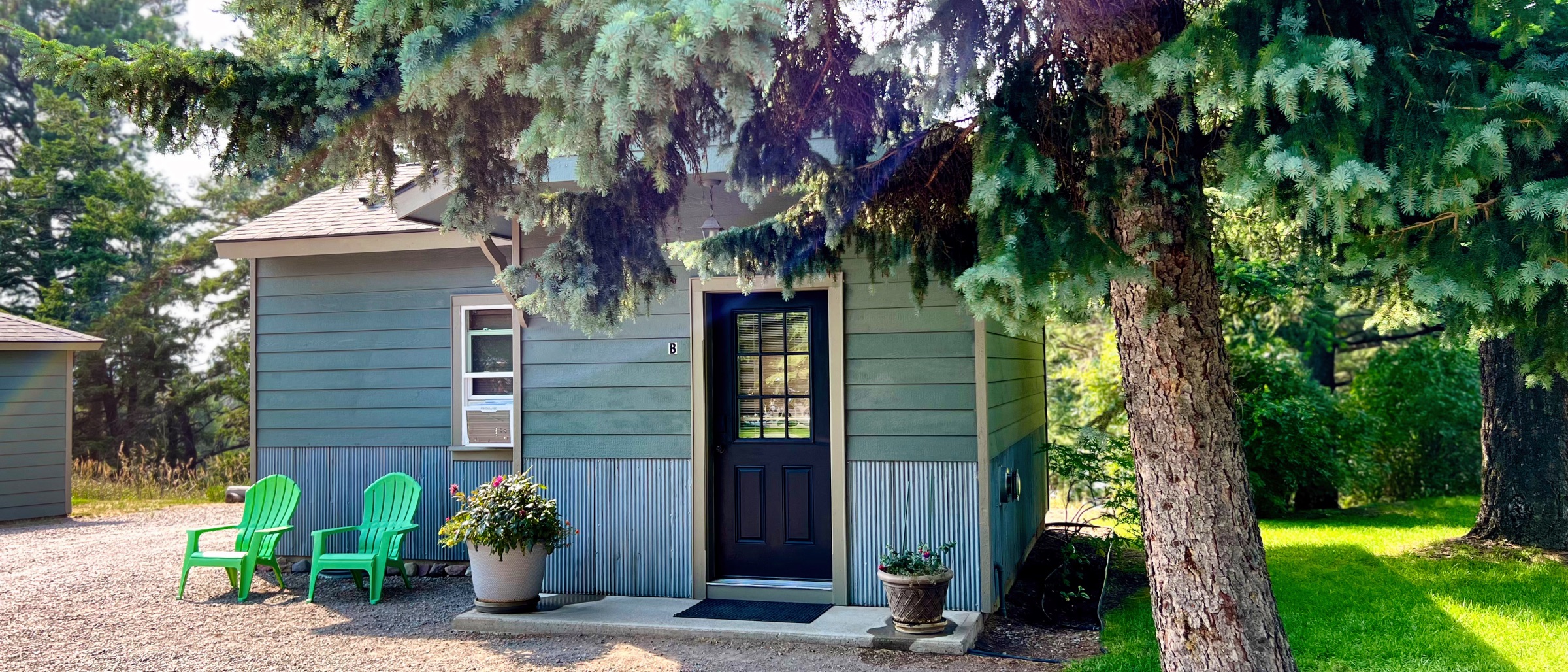 South-facing porch. The aspens behind turn first.